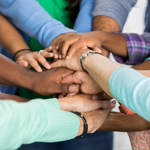 Group of people with hands together